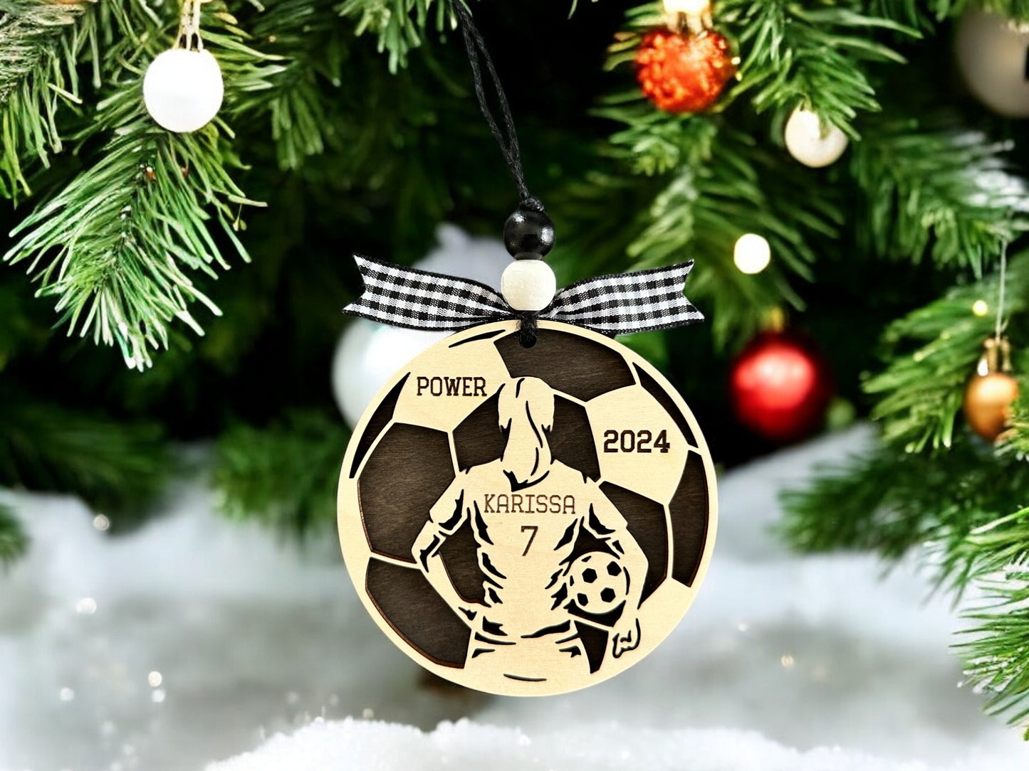 Personalized Soccer Girl Christmas Ornament with player jersey number, name, team name and year. The perfect Soccer lovers Christmas gift.